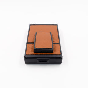 Polaroid SX-70 Alpha instant camera in black with restored caramel leather, converted to accept 600 film