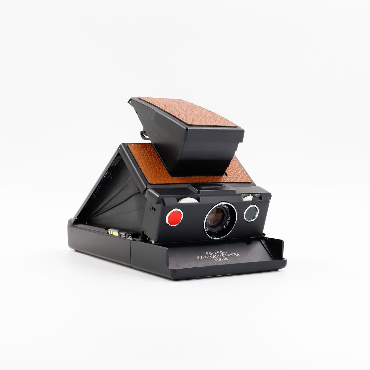 Polaroid SX-70 Alpha instant camera in black with restored caramel leather, converted to accept 600 film