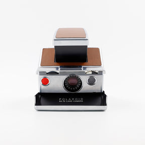 Polaroid SX-70 Land instant camera in silver with restored caramel leather, converted to accept 600 film