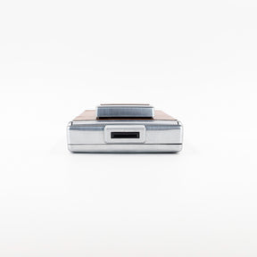 Polaroid SX-70 Land instant camera in silver with restored caramel leather, converted to accept 600 film