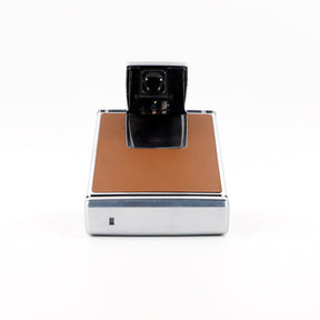 Polaroid SX-70 Land instant camera in silver with restored caramel leather, converted to accept 600 film