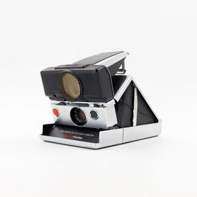 Polaroid SX-70 Land Sonar instant camera in silver with restored black leather, converted to accept 600 film