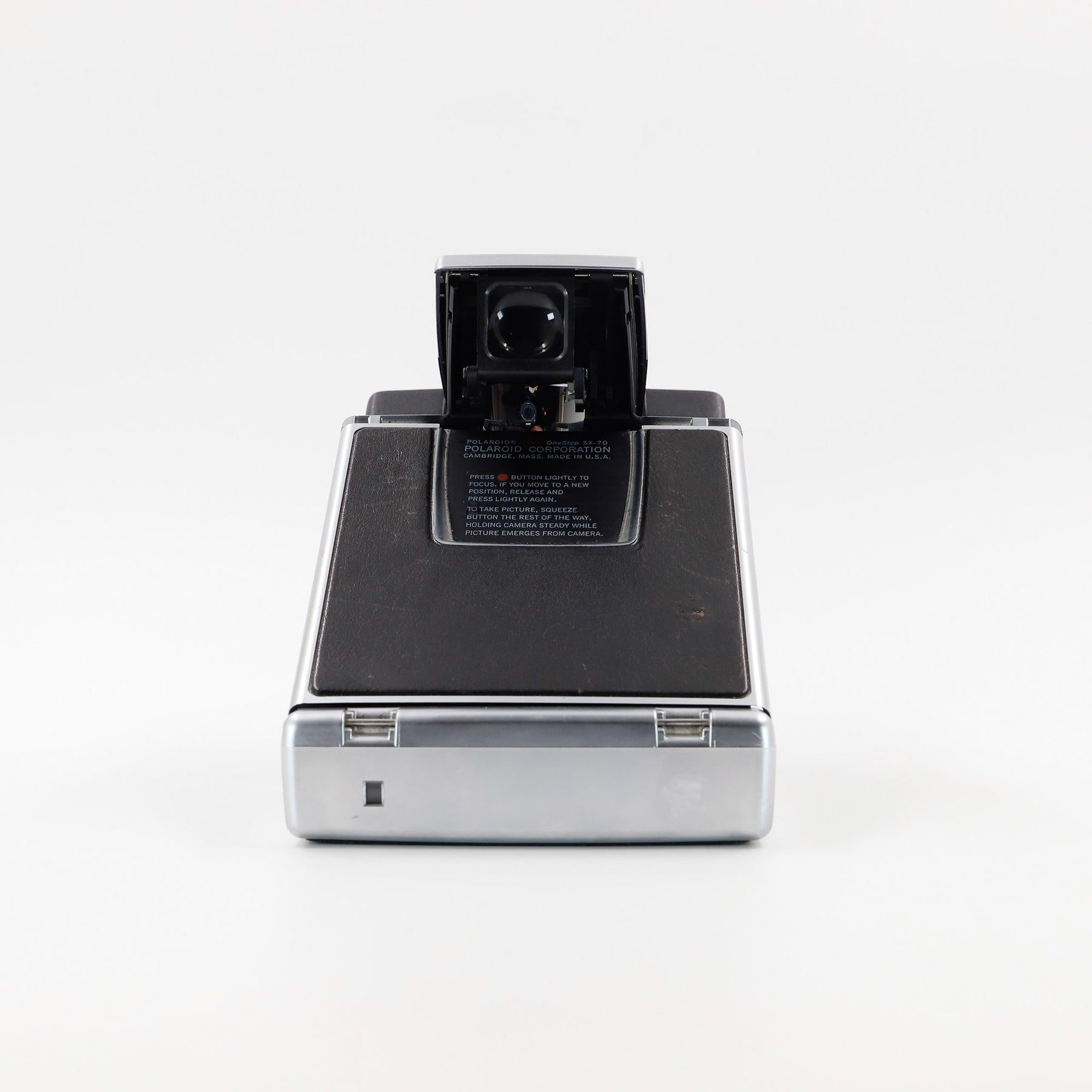 Polaroid SX-70 Land Sonar instant camera in silver with original black leather, converted to accept 600 film