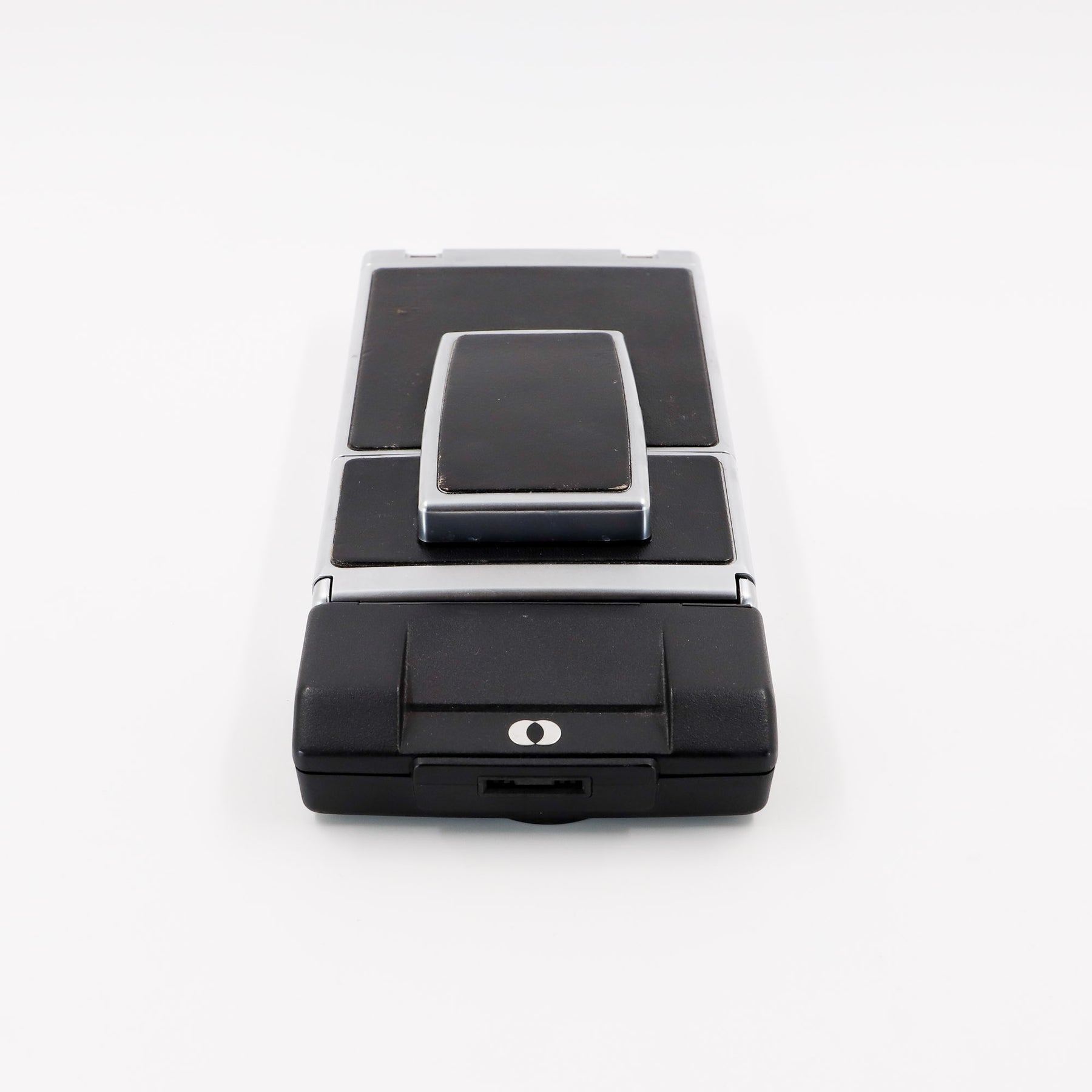 Polaroid SX-70 Land Sonar instant camera in silver with original black leather, converted to accept 600 film