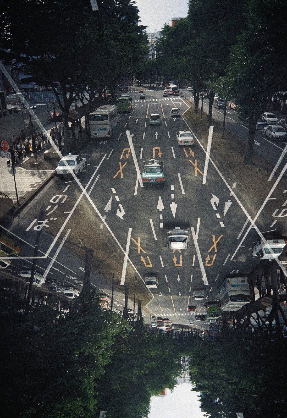 Sample image taken on the Kodak Snapic A1: double exposure of a tree-lined street with taxis and buses